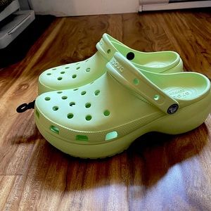 Platform crocs in the celery colour. New, have not been worn at all.